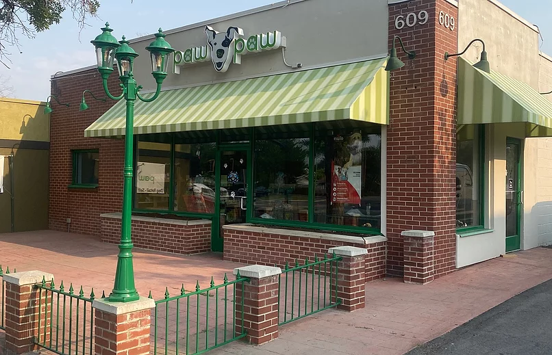 Paw Paw pet store sits in Sugarhouse . The boutique has brick and lime green accents.